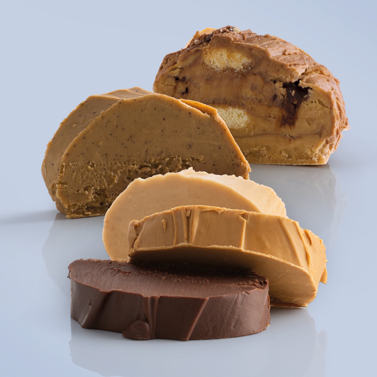 Delicious slices of Father's Day fudge flavours lined up to show the difference in the flavours included in the sleection, displayed on a blue background.