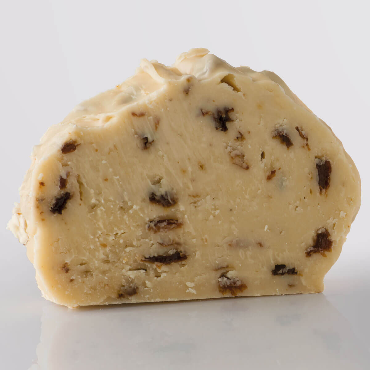 Rum & Raisin Fudge, a Fudge Kitchen indulgent, handmade Fudge flavour, ideal for gifting or enjoying as a treat displayed in a single slice.