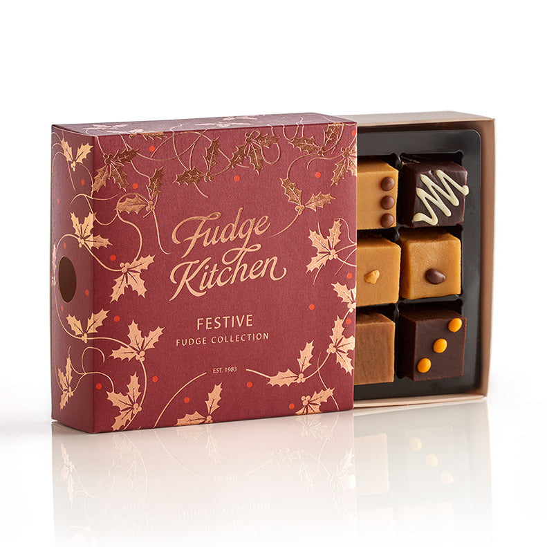 Fudge Kitchen festive fudge collection box with fudges in a decorative box on a white background.