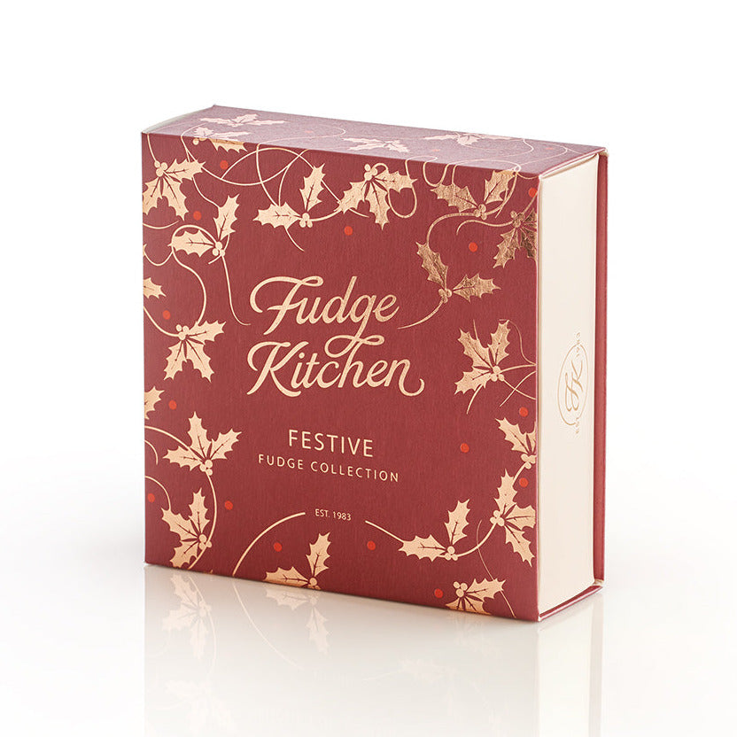 Fudge Kitchen festive fudge collection box with holly design on a white background