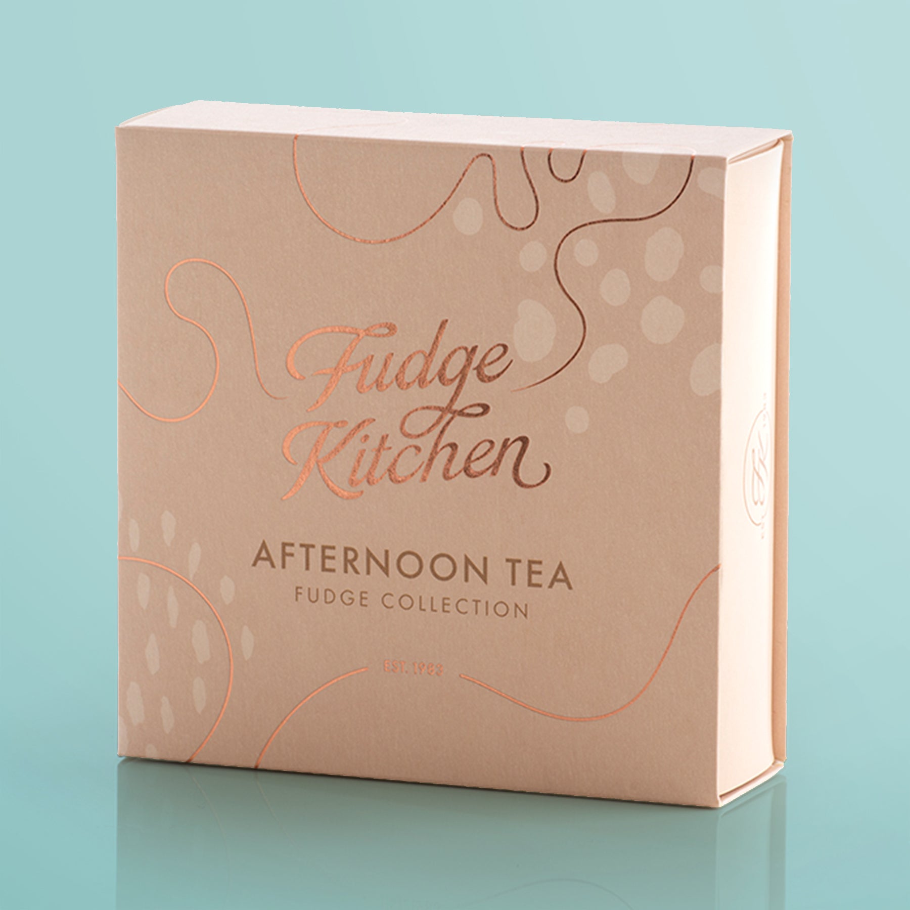 Fudge Kitchen afternoon tea packaging on a light blue background