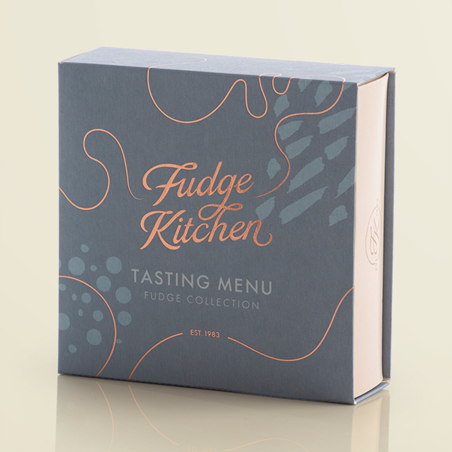Fudge Kitchen tasting menu box on a light yellow background