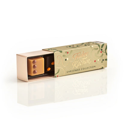 Long festive Fudge Kitchen gift box, slightly open to reveal a piece of salted caramel fudge, displayed on a white background.