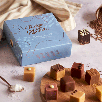 Fudge Kitchen Tasting Menu fudge selection displayed with fudges and rotating celebration theme sleeves.