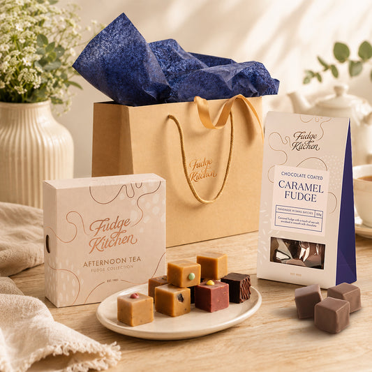 Assorted Fudge Kitchen confectionery items including fudge and chocolate coated fudge with a plant and vase in the background.