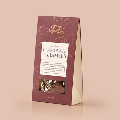 Fudge Kitchen artisan chocolate caramels packaging on a light blue background
