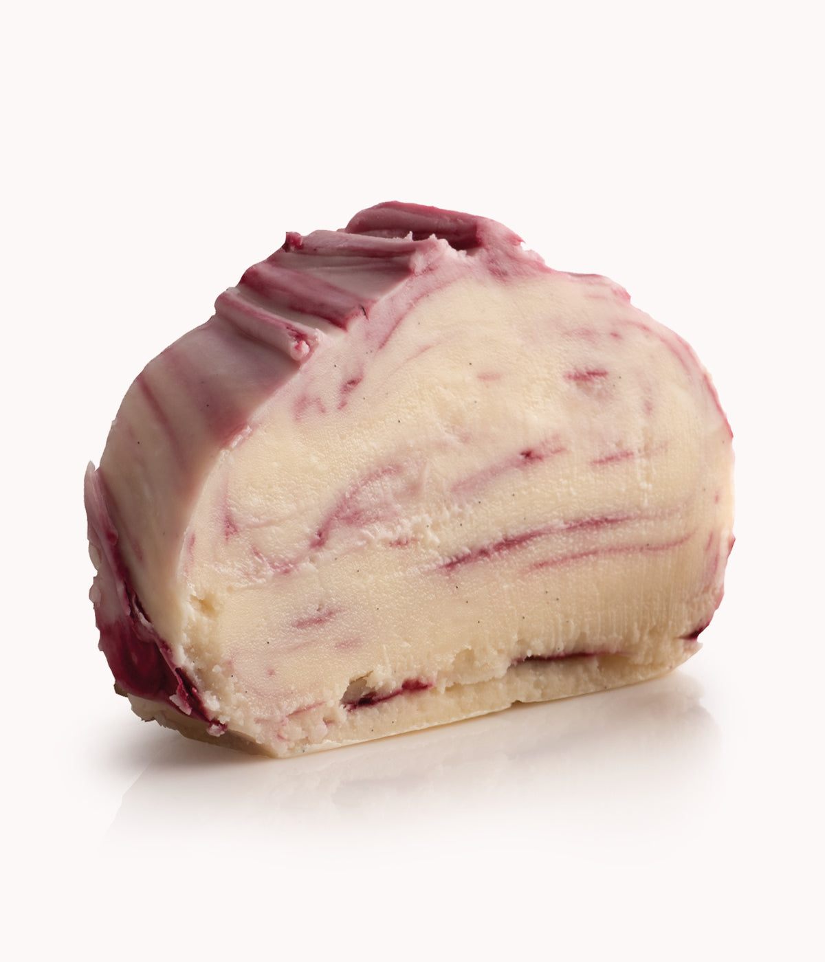 Single slice of artisan fudge. A Cherry Swirl flavour fudge showing cherries swirled throughout a vanilla slice of fudge, displayed on a white background.