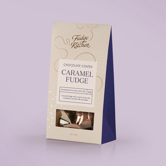 Fudge Kitchen chocolate enrobed saltedcaramel fudge packaging on a light purple background