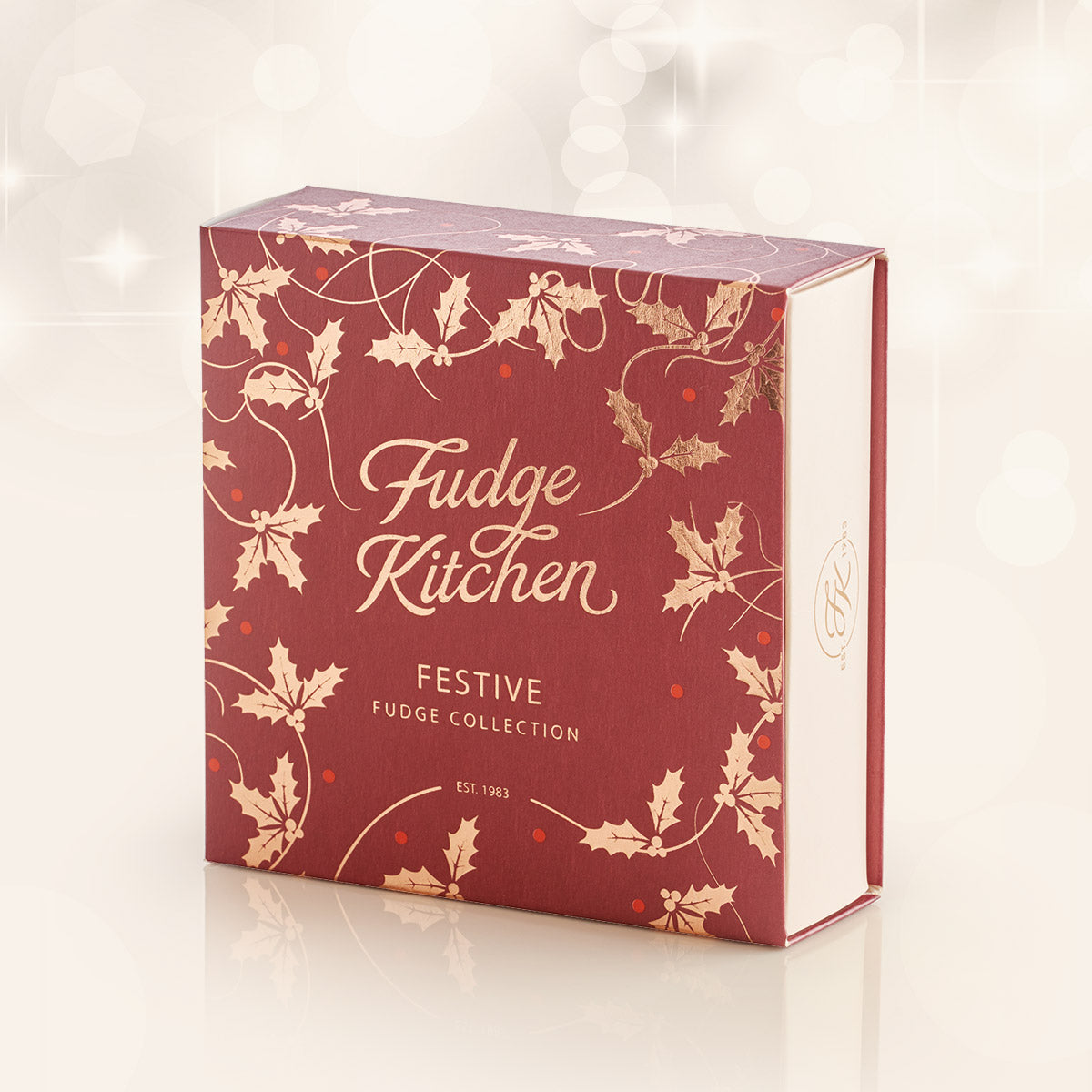 Fudge Kitchen festive fudge collection box with holly design on a white background