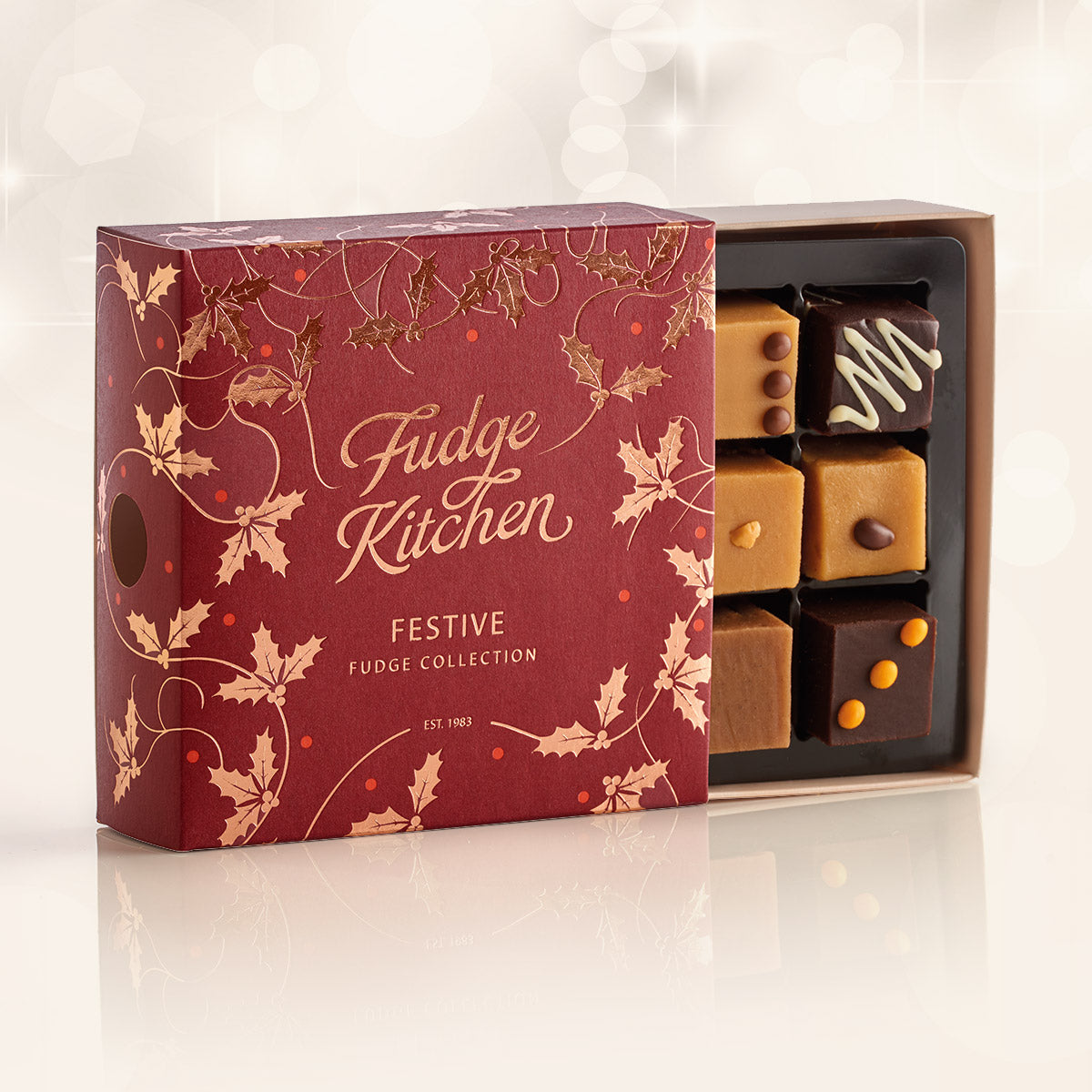 Fudge Kitchen festive fudge collection box with fudges in a decorative box on a white background.