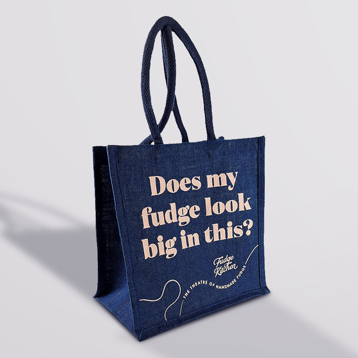 Fudge Kitchen Shopping Bag, a durable and eco-friendly hessian bag featuring the Fudge Kitchen logo. Perfect for carrying your fudge or everyday essentials in a sustainable and stylish way.