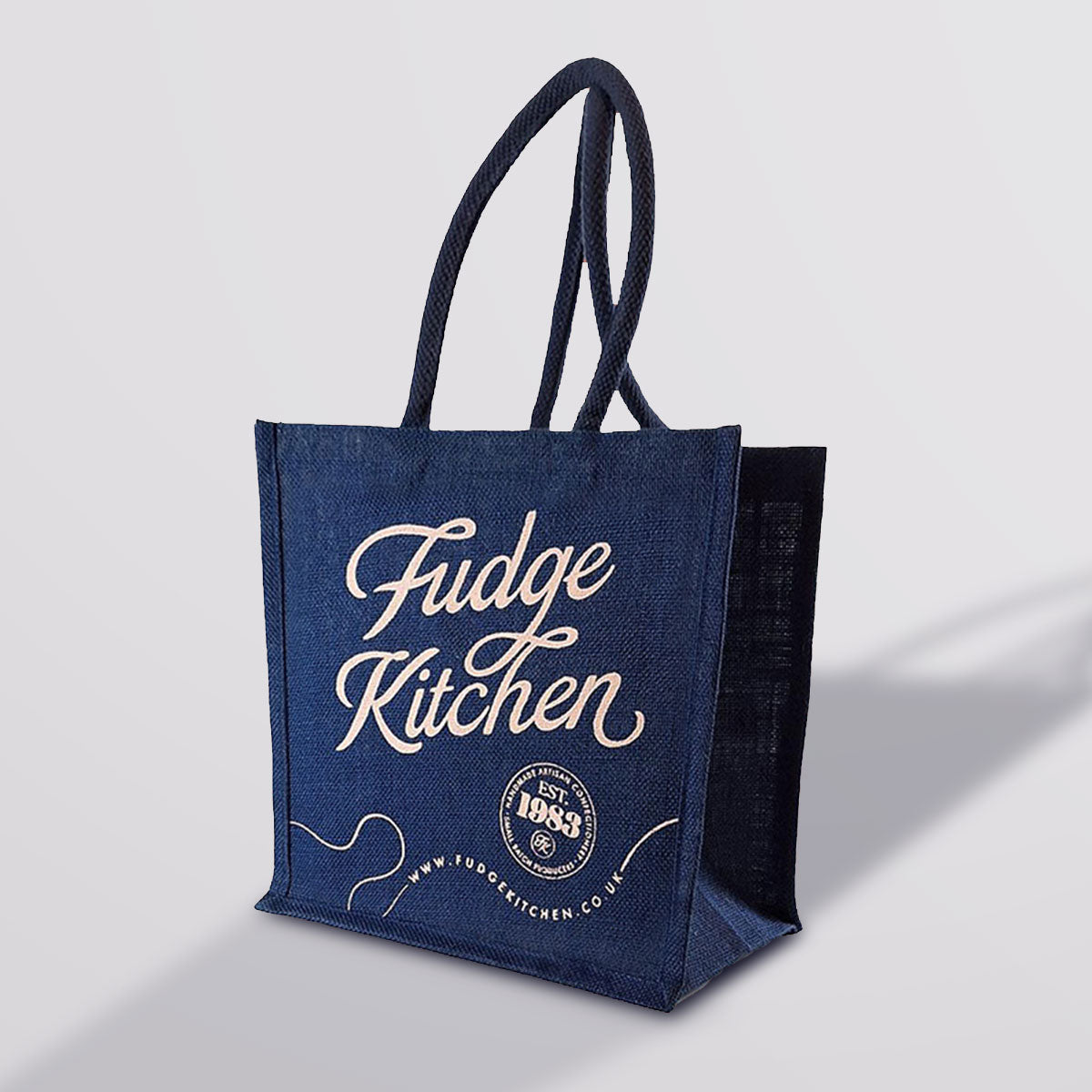 Fudge Kitchen Shopping Bag, highlighting the high-quality fabric and the bold Fudge Kitchen logo. A practical and stylish accessory for fudge lovers and eco-conscious shoppers.
