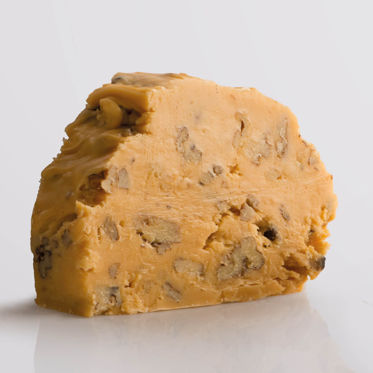 Maple Walnut Fudge Special, a Fudge Kitchen indulgent, handmade fresh fudge flavour shown in a single slice on a white background.