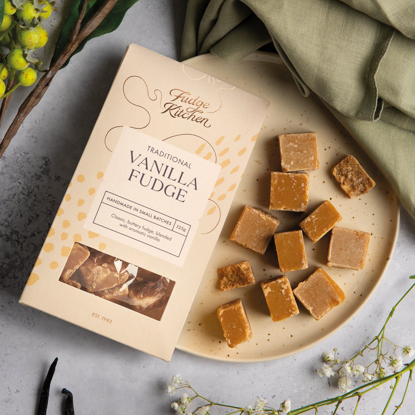 Traditional Vanilla Fudge served on a plate, arranged beautifully in a cosy, lifestyle table setting. Perfect for sharing or gifting.
