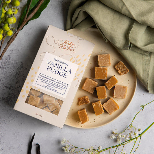 Traditional Vanilla Fudge served on a plate, arranged beautifully in a cosy, lifestyle table setting. Perfect for sharing or gifting.