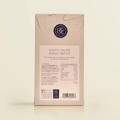 Package of lightly salted peanut brittle with brand logo and nutritional information on a beige background