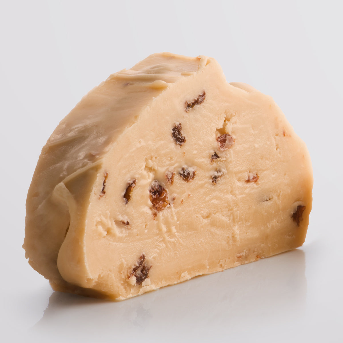 Rum & Raisin Fudge, a Fudge Kitchen indulgent, handmade Fudge flavour, ideal for gifting or enjoying as a treat displayed in a single slice.