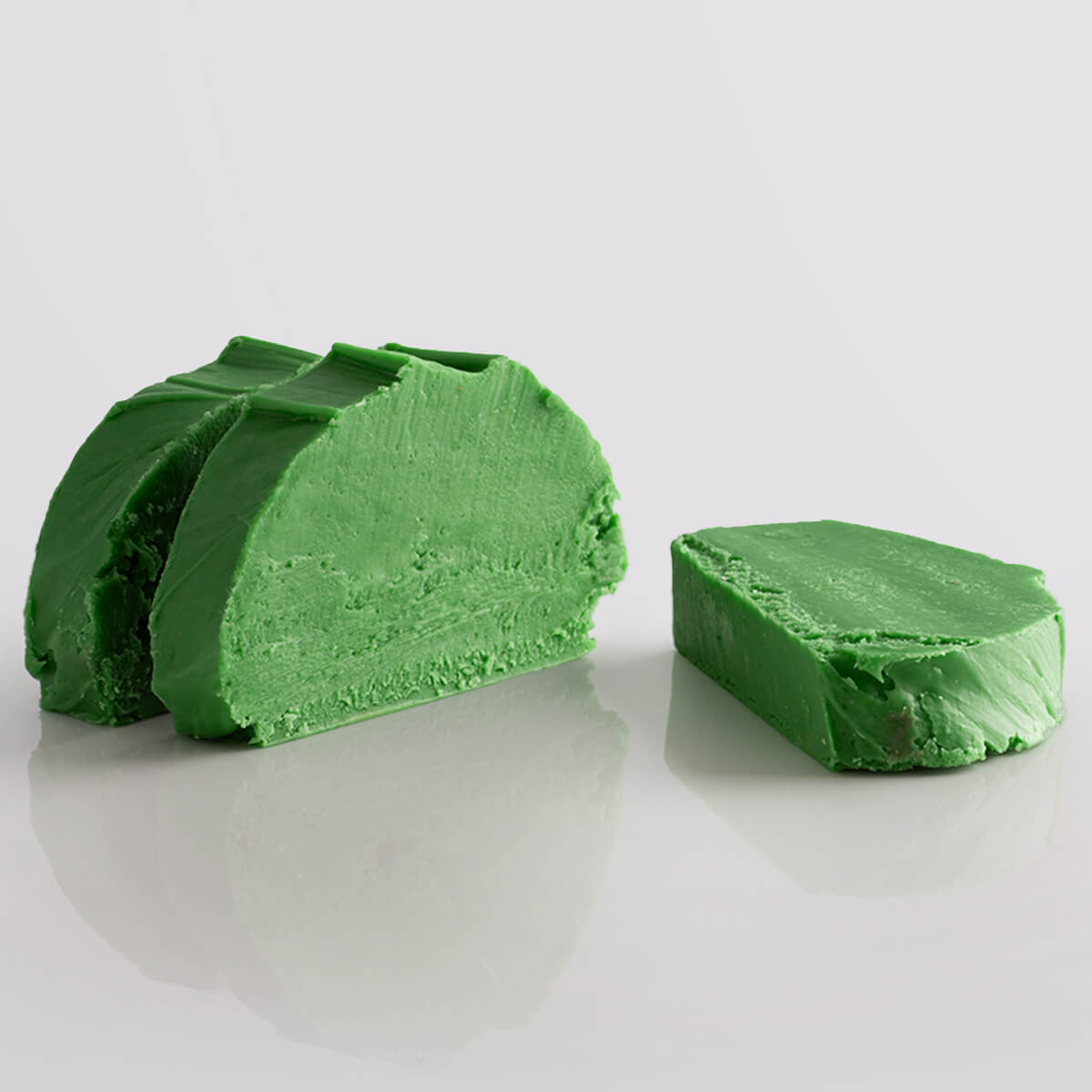Apple Sour Fudge Special, a Fudge Kitchen indulgent, handmade fresh fudge flavour shown in 3 slices.