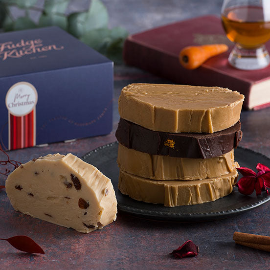 Festive Christmas fudge gift box filled with rich, creamy fudge pieces in assorted flavours, beautifully displayed on a table with holiday decorations - perfect for holiday gifting or festive indulgence.