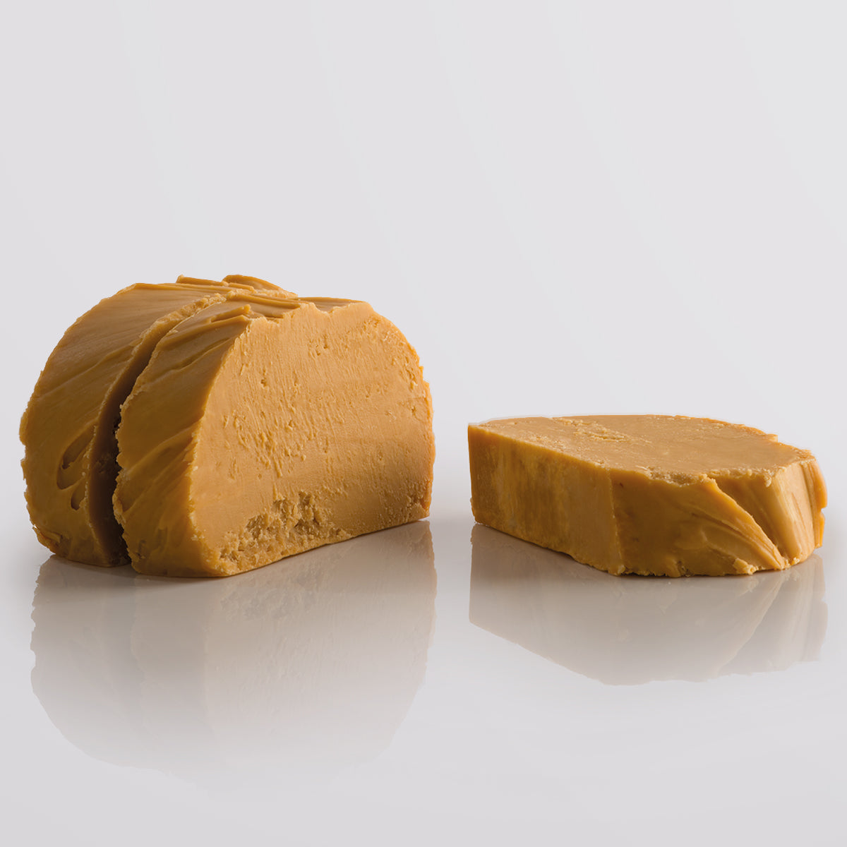 Butterscotch Fudge, a Fudge Kitchen indulgent, handmade Fudge flavour displayed in 3 slices.