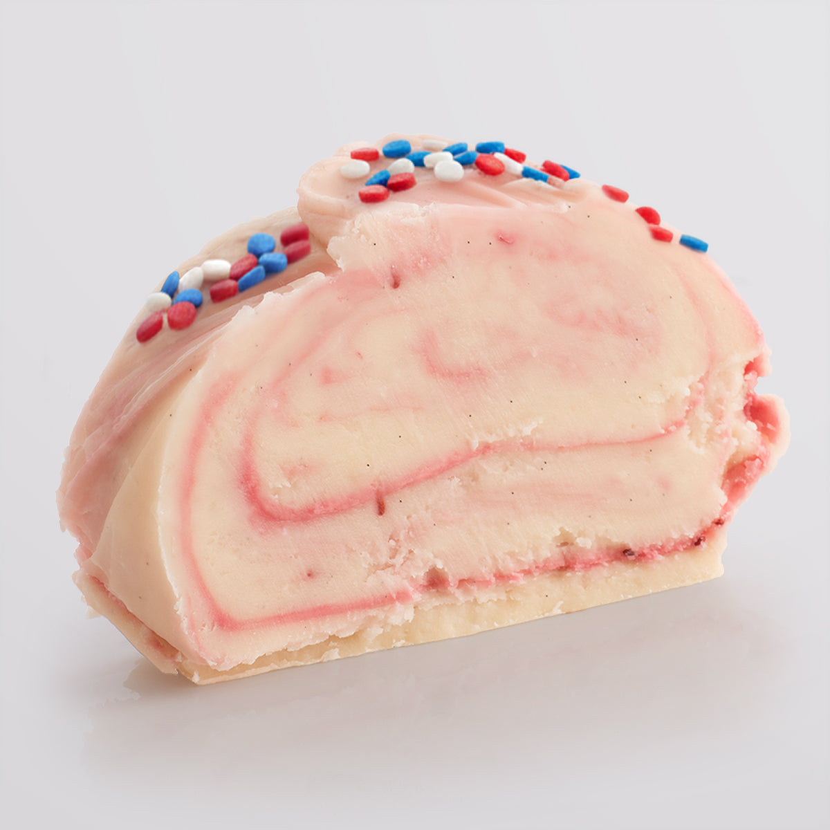 Jam roly poly fudge on a light grey background.