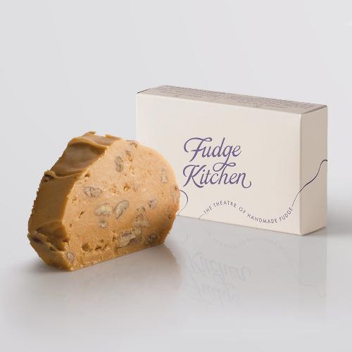 Maple Walnut Fudge, a Fudge Kitchen indulgent, handmade fudge flavour displayed with an elegant gift box.