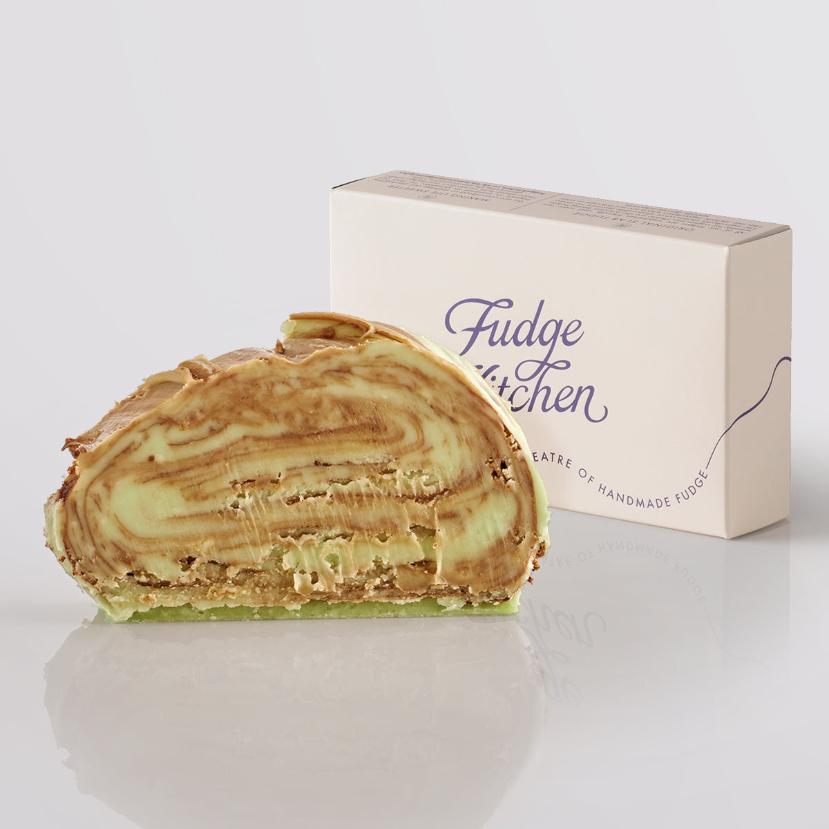 Mint Chocolate Swirl Fudge single slice, a Fudge Kitchen indulgent, handmade fudge flavour displayed with an elegant gift box.