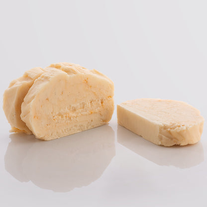 Three slices of Peaches and Cream Fudge, a Fudge Kitchen indulgent, handmade Fudge flavour displayed with on a glight grey background.