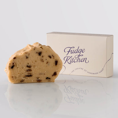 Rum & Raisin Fudge single slice, a Fudge Kitchen indulgent, handmade fudge flavour displayed with an elegant gift box.