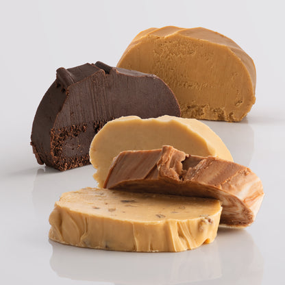 Close-up of thick sliced, fresh fudge on a light grey background