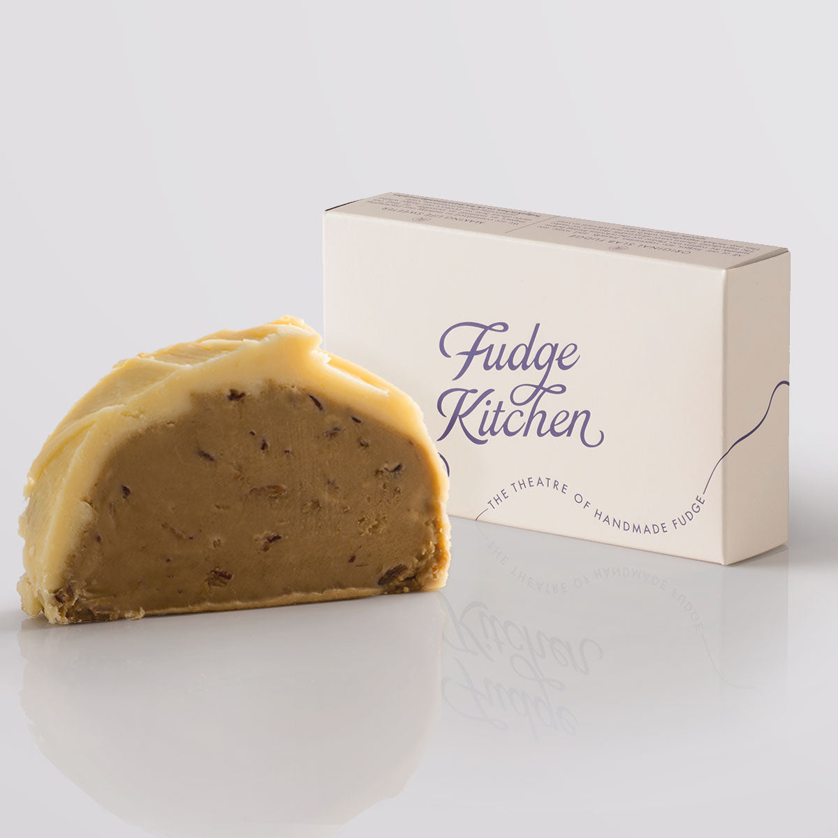 Sticky Toffee Pudding Fudge single slice, a Fudge Kitchen indulgent, handmade fudge flavour displayed with an elegant gift box.