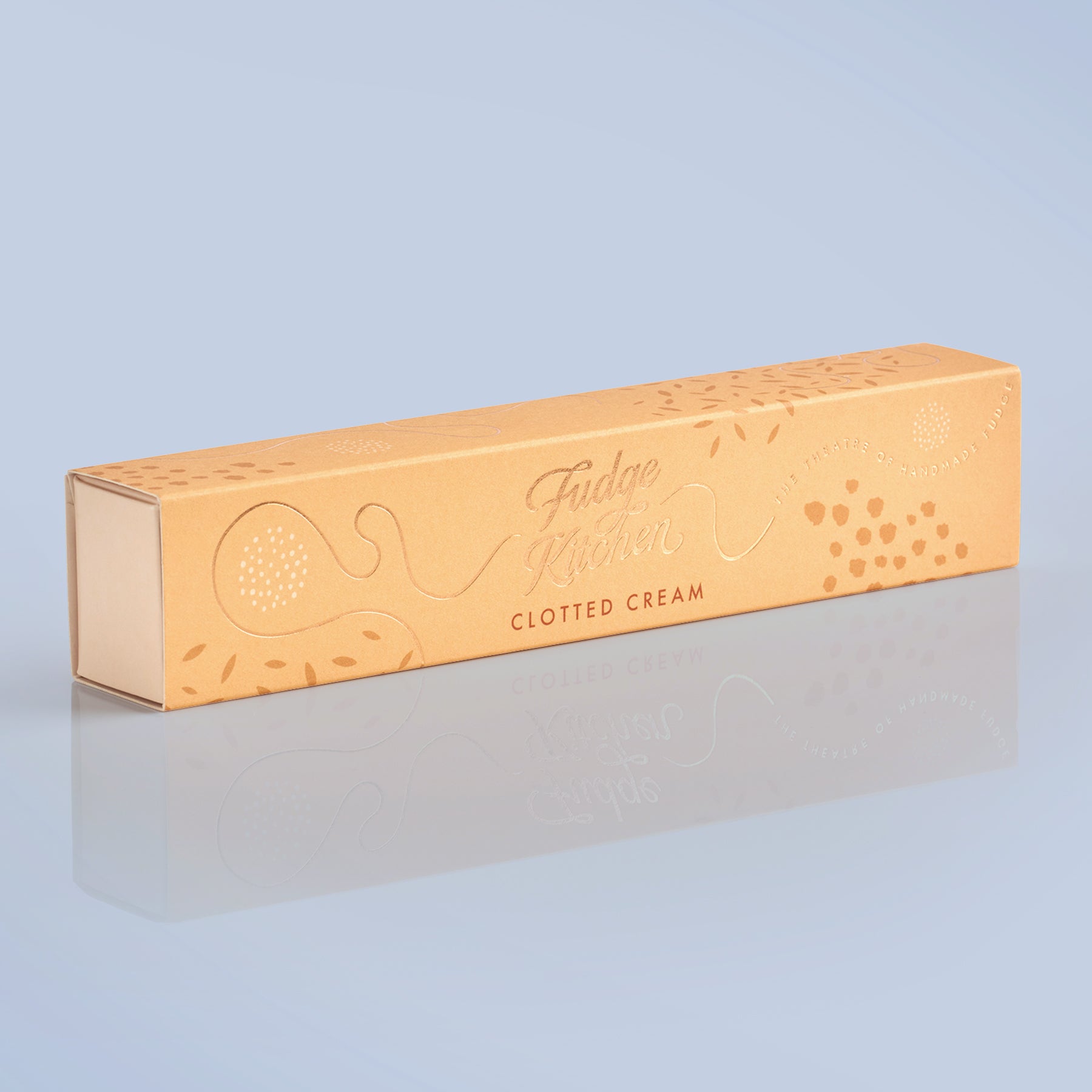Rectangular box of clotted cream fudge with branding on a light blue background
