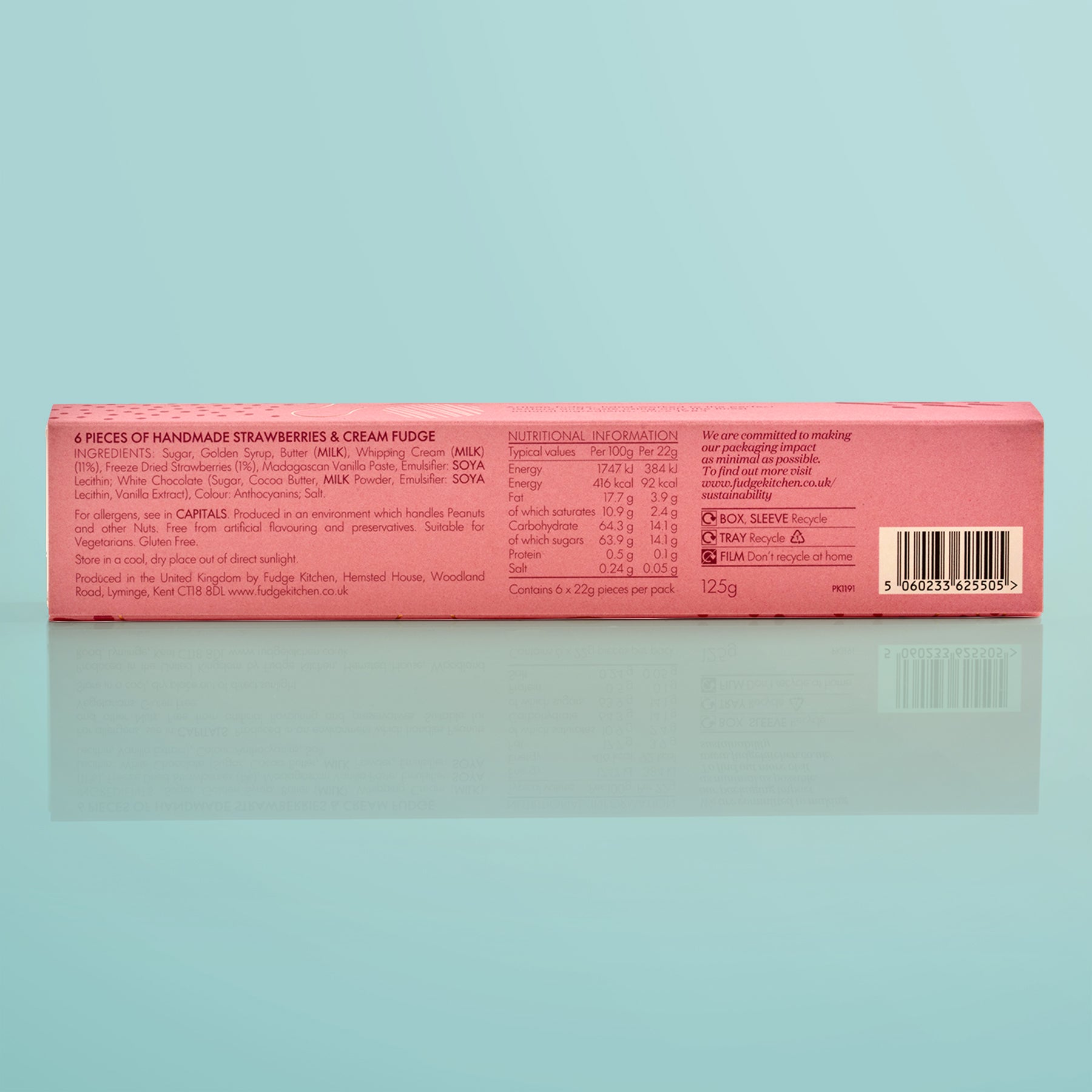 Box of handmade strawberries & cream fudge with nutritional information on a light yellow background.