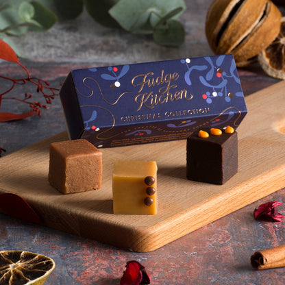 Handmade Christmas Trio Fudge Slider by Fudge Kitchen displayed on a board, offering three rich and creamy fudge flavours in a festive, beautifully packaged selection. The perfect Christmas gift or treat for fudge lovers.