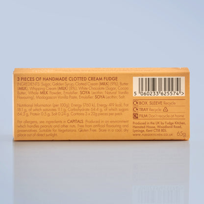 Box of handmade clotted cream fudge with ingredients list on a light blue background