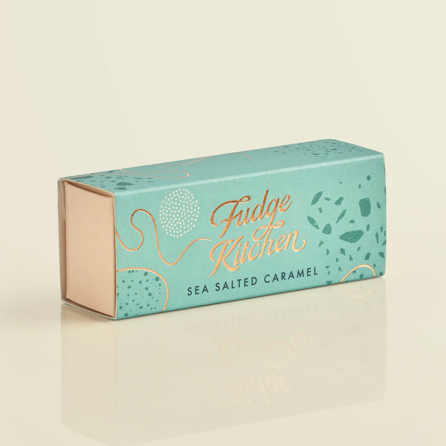 Fudge Kitchen sea salted caramel fudge box on a beige background