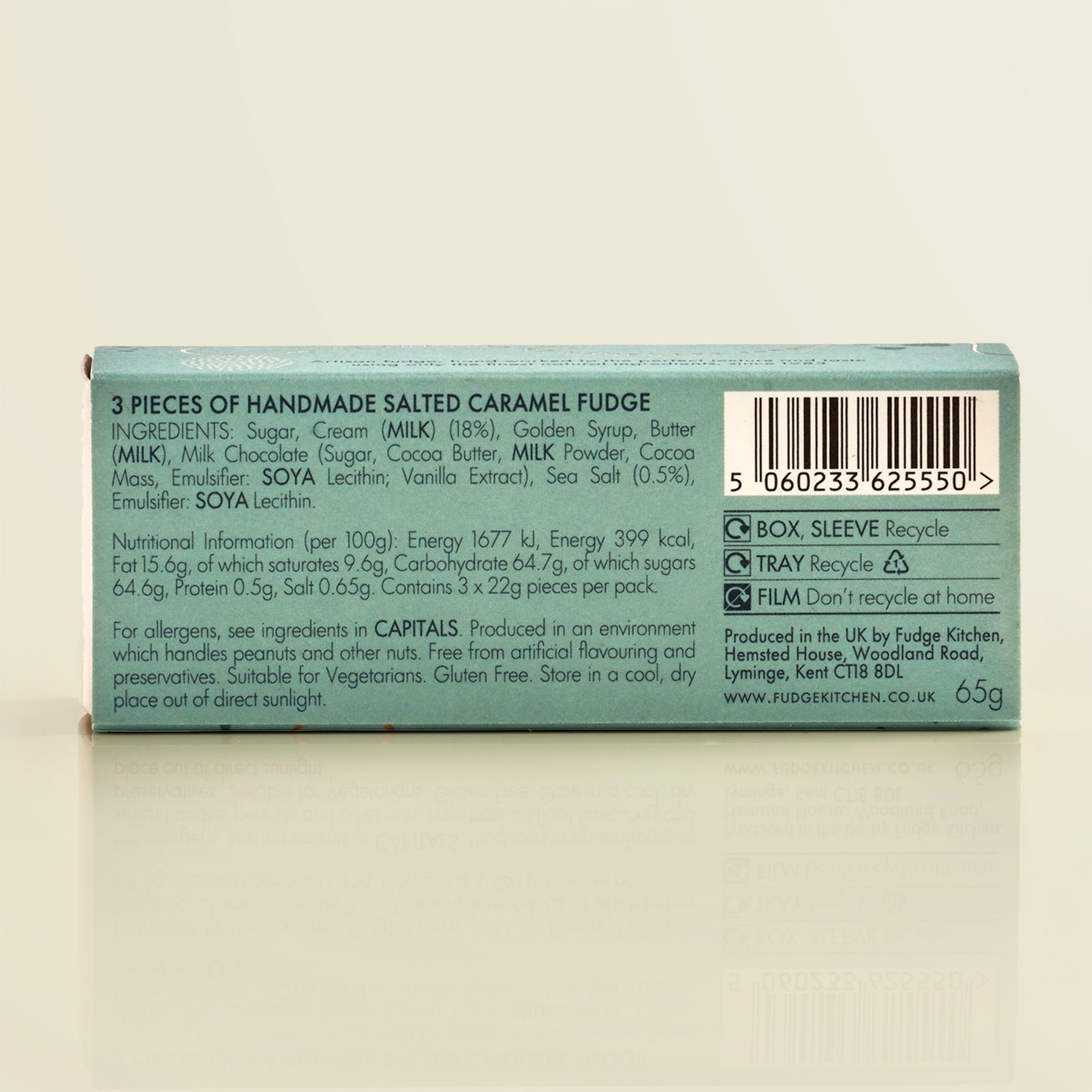 Back of a fudge packaging showing ingredients and recycling information on a beige background
