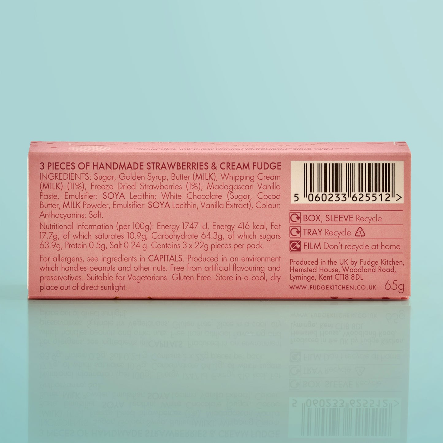 Box of handmade strawberries & cream fudge with nutritional information on a light blue background