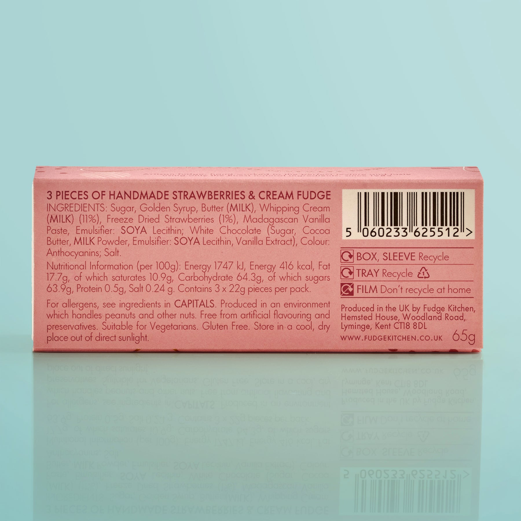Box of handmade strawberries & cream fudge with nutritional information on a light blue background