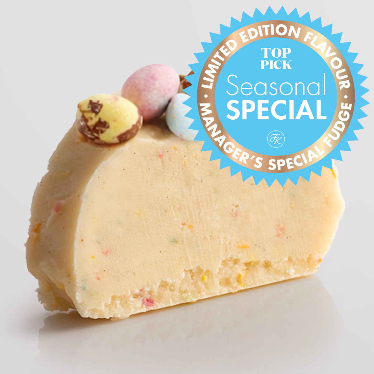 A slice of Speckled Egg Fudge with colourful sprinkles, topped with crushed chocolate eggs, on a light gray background, featuring a 'Limited Edition Flavour' badge.