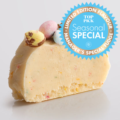 A slice of Speckled Egg Fudge with colourful sprinkles, topped with crushed chocolate eggs, on a light gray background, featuring a 'Limited Edition Flavour' badge.