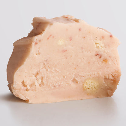 Single slice of Strawberry Cheesecake Fudge, a Fudge Kitchen indulgent, handmade fresh fudge flavour.