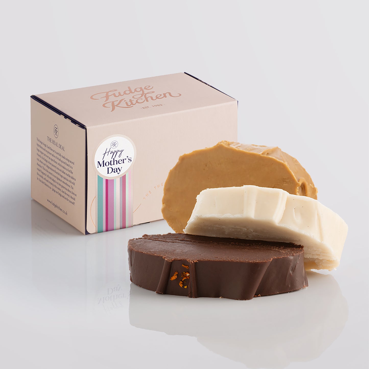 Vegan fudge trio elegantly displayed in a buff-coloured gift box with gilded accents with a 'Happy Mother's Day' box seal.