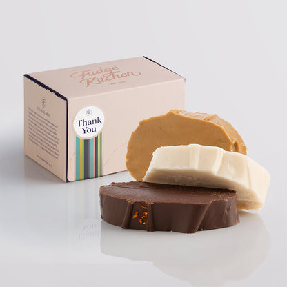 Vegan fudge trio elegantly displayed in a buff-coloured gift box with gilded accents with a 'Thank You' box seal.