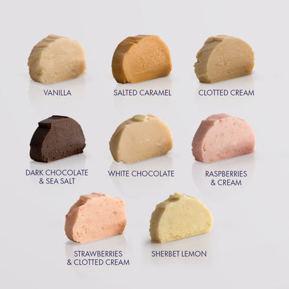 Nine fudge confection slices arranged in a 3-by-3 grid on a light gray background, each labeled with a flavour name: Vanilla, Salted Caramel, Clotted Cream, Dark Chocolate & Sea Salt, White Chocolate, Raspberries & Cream, Strawberries & Clotted Cream, and Sherbet Lemon.