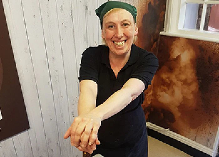 The York Fudge shop manager posing whilst making fudge