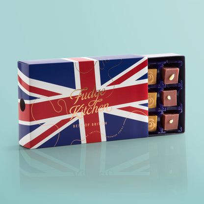A premium 15-piece fudge selection box from Fudge Kitchen, featuring British-inspired flavours such as Strawberries & Clotted Cream and Traditional Vanilla, presented in sustainable packaging.