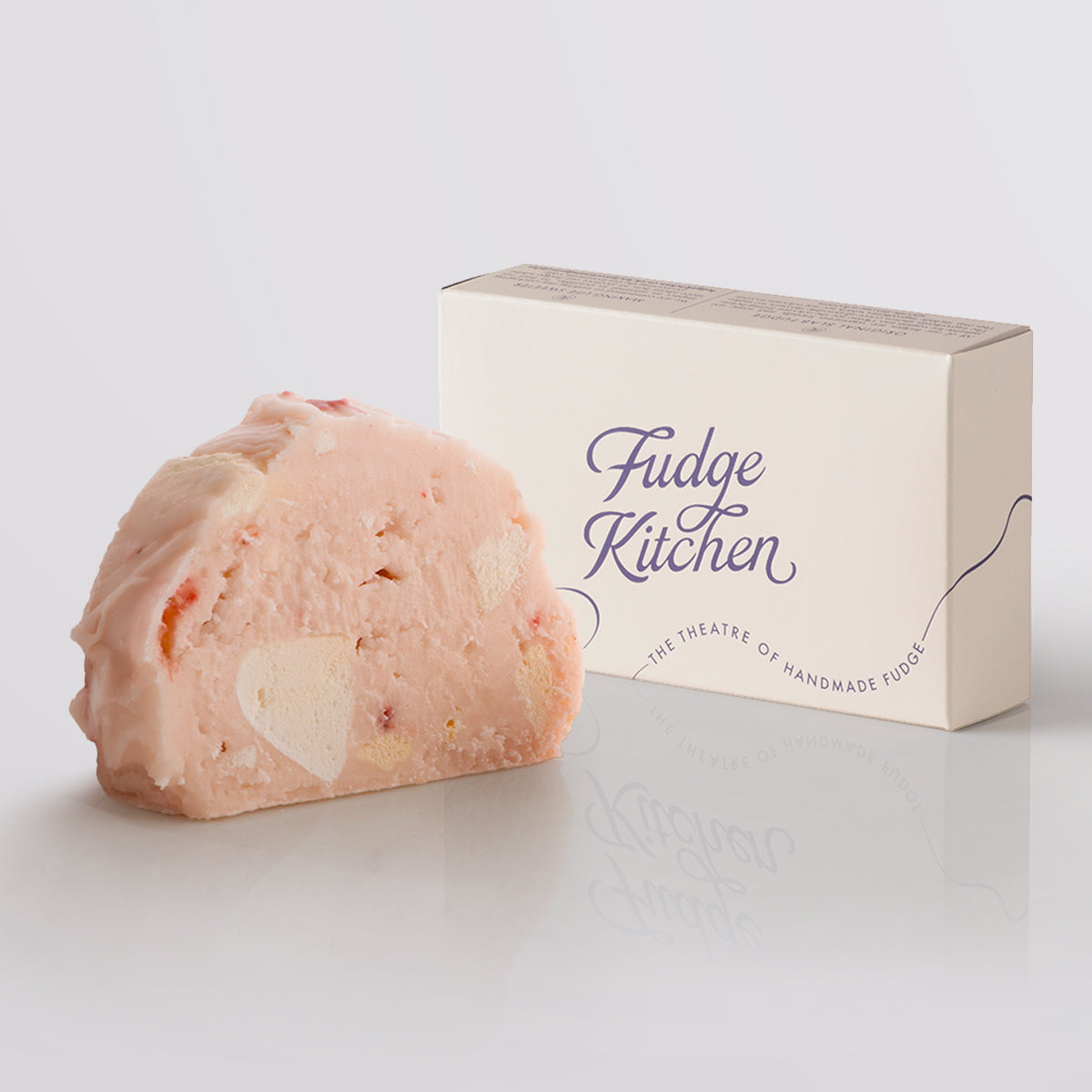 Eton Mess Fudge single slice, a Fudge Kitchen indulgent, handmade fudge flavour displayed with an elegant gift box.
