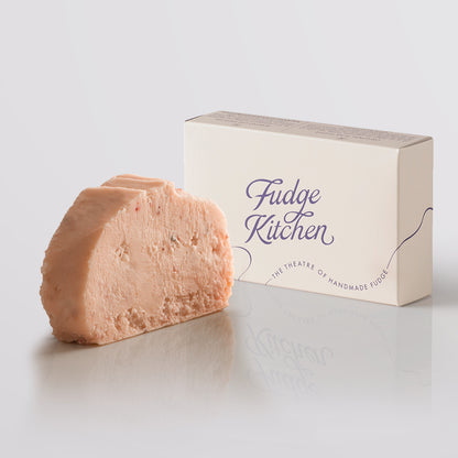 Strawberries & Cream Fudge single slice, a Fudge Kitchen indulgent, handmade fudge flavour displayed with an elegant gift box.
