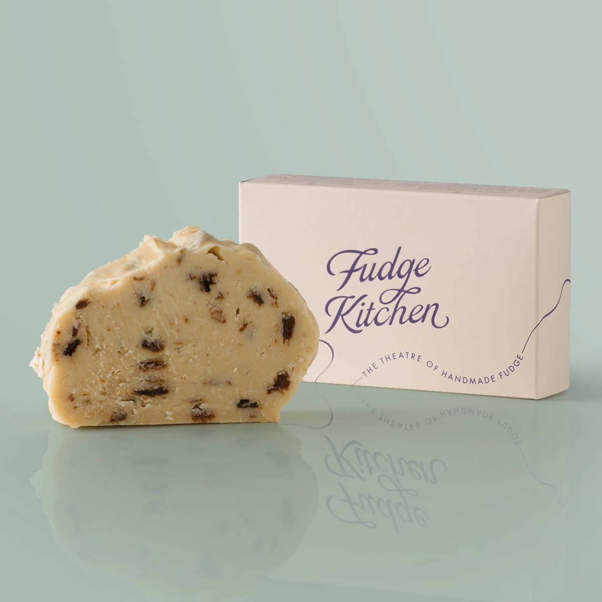 Rum & Raisin Vegan Fudge single slice, a Fudge Kitchen indulgent, handmade vegan Fudge flavour displayed with an elegant gift box.